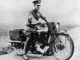 t-e-lawrence-lawrence-of-arabia-sitting-on-his-motorbike.jpg