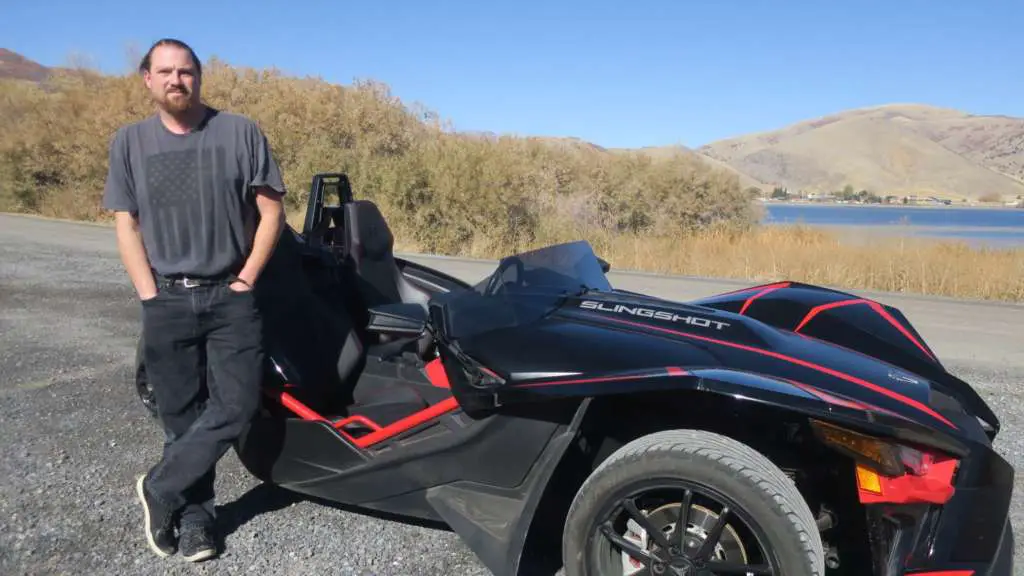 Staff writer Eric Leaverton stands next to the Slingshot R.
